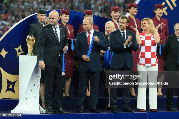 President Gianni Infantino , Russian President Vladimir Putin , French President Emmanuel Macron and Croatian President Kolinda Grabar-Kitarovic...