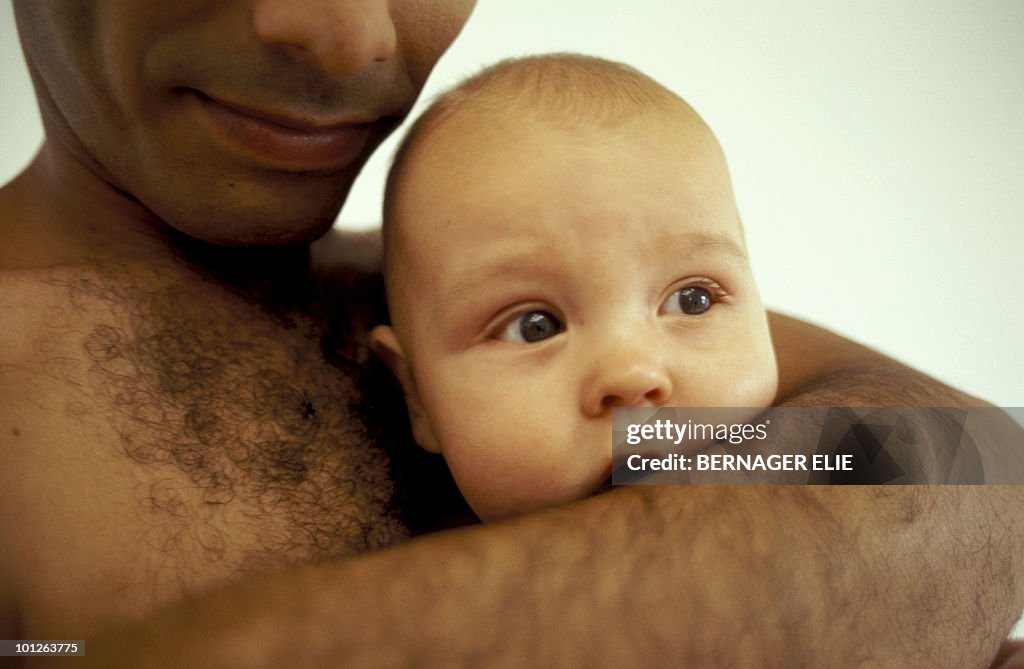 Father holding baby