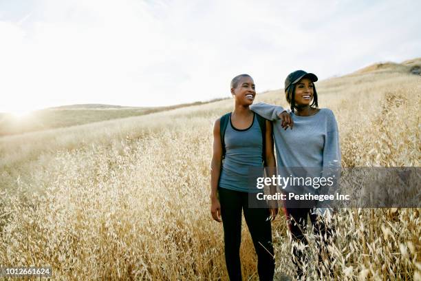 women hiking in park - african american couple walking park ストックフォトと画像