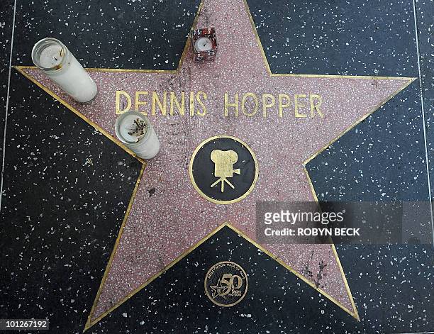 Candles rest on the star of actor Dennis Hopper following news of his death, on the Hollywood Walk of Fame in the Hollywood section of Los Angeles on...