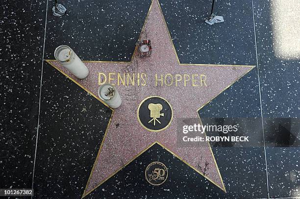 Candles rest on the star of actor Dennis Hopper following news of his death, on the Hollywood Walk of Fame in the Hollywood section of Los Angeles on...