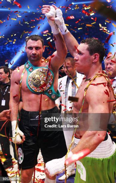 Vitali Klitschko of Ukraine shakes hands with Albert Sosnowski of Poland after winning the WBC Heavyweight World Championship fight against Albert...