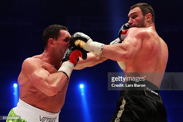 Vitali Klitschko of Ukraine hits Albert Sosnowski of Poland during the WBC Heavyweight World Championship fight between Vitali Klitschko of Ukraine...