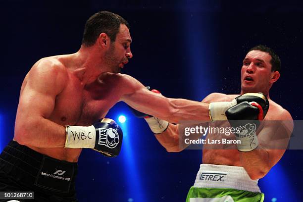 Vitali Klitschko of Ukraine hits Albert Sosnowski of Poland during the WBC Heavyweight World Championship fight between Vitali Klitschko of Ukraine...