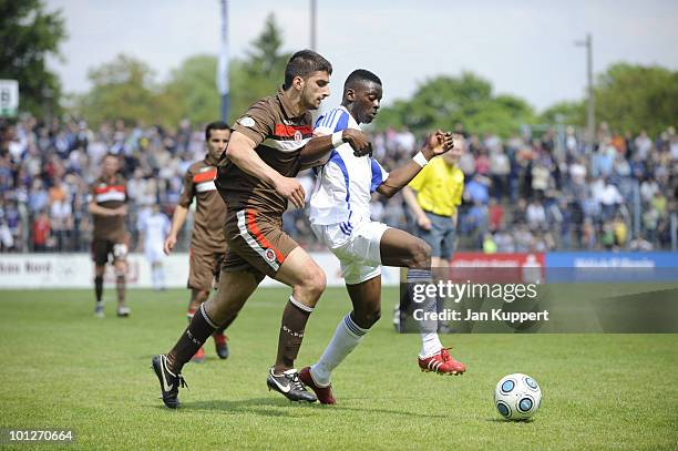 Yasar Koca of St.Pauli II and Denis Weidlich of Babelsberg challenge for the ball during the Regionalliga match between SV Babelsberg and FC St....