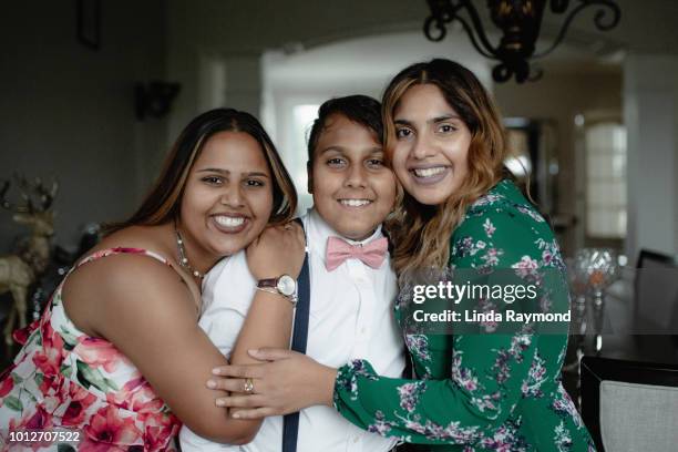 Indian teenage boy with his sisters