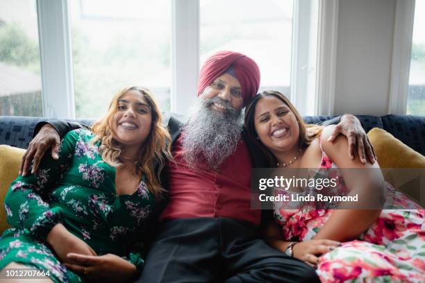 indian father with his two daughter - sikhism stock pictures, royalty-free photos & images