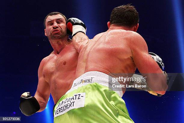 Albert Sosnowski of Poland hits Vitali Klitschko of Ukraine during the WBC Heavyweight World Championship fight between Vitali Klitschko of Ukraine...