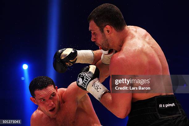 Albert Sosnowski of Poland hits Vitali Klitschko of Ukraine during the WBC Heavyweight World Championship fight between Vitali Klitschko of Ukraine...