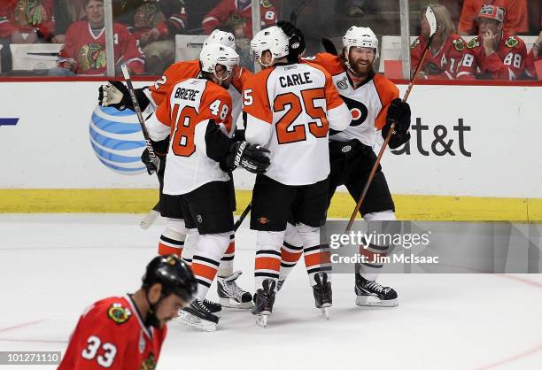 Danny Briere of the Philadelphia Flyers celebrates with teammates Matt Carle, Chris Pronger, Scott Hartnell as Dustin Byfuglien of the Chicago...