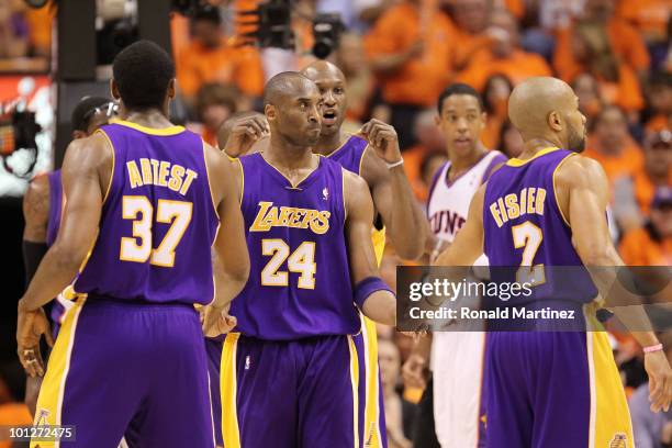 Ron Artest, Kobe Bryant, Lamar Odom and Derek Fisher of the Los Angeles Lakers celebrate a play against the Phoenix Suns in the third quarter of Game...