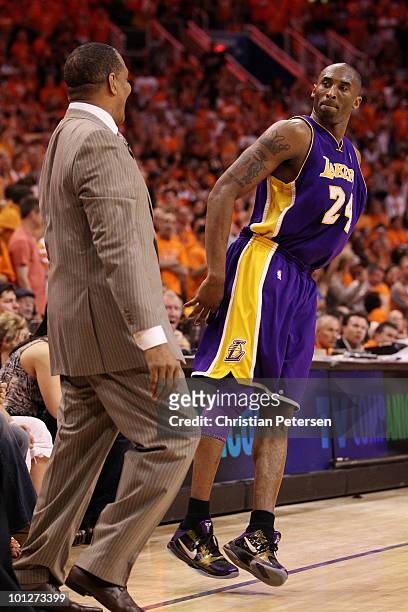 Kobe Bryant of the Los Angeles Lakers looks at head coach Alvin Gentry of the Phoenix Suns after a play in the fourth quarter of Game Six of the...