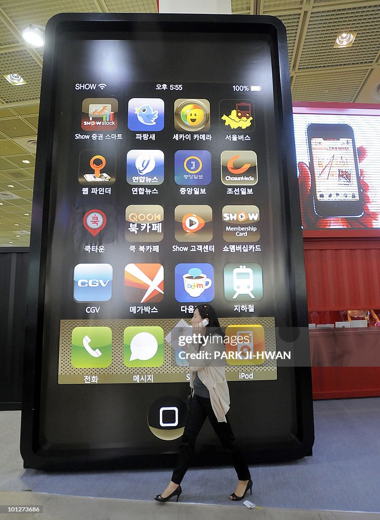 A South Korean woman walks past a smart