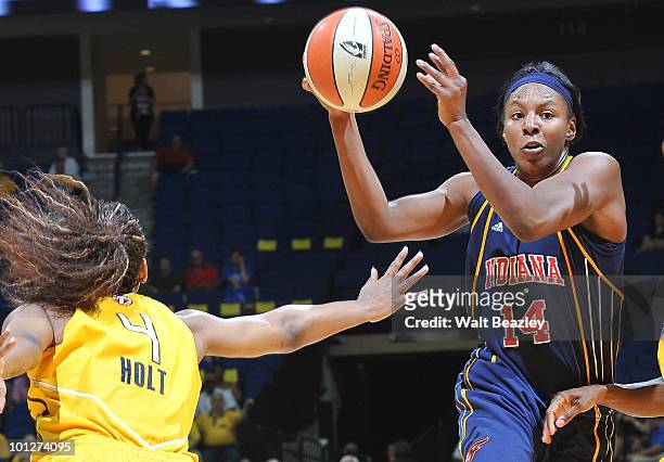 Shay Murphy of the Indiana Fever drives the ball into the lane against Amber Holt of the Tulsa Shock at the Bok Center May 29, 2010 in Tulsa,...