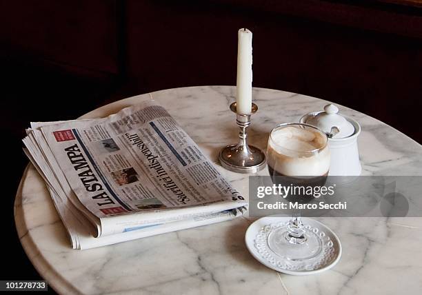 Glass of Bicerin is placed on a table inside the Al Bicerin cafe on May 28, 2010 in Turin, Italy. The cafe, situated in front of the entrance of the...