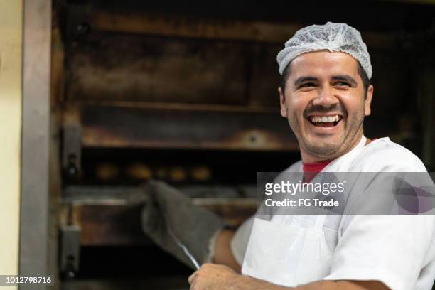 portrait of a baker - baker occupation stock pictures, royalty-free photos & images