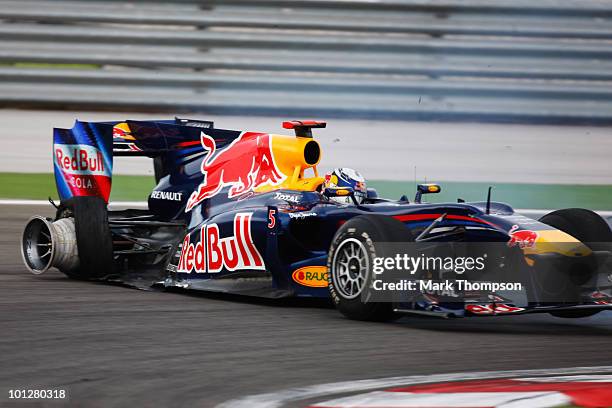 Sebastian Vettel of Germany and Red Bull Racing crashes out after colliding with his team mate Mark Webber of Australia and Red Bull Racing during...