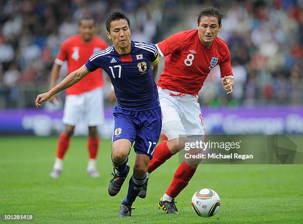 Makoto Hasebe of Japan is challenged by Frank Lampard of England during the International Friendly match between Japan and England at the UPC-Arena...