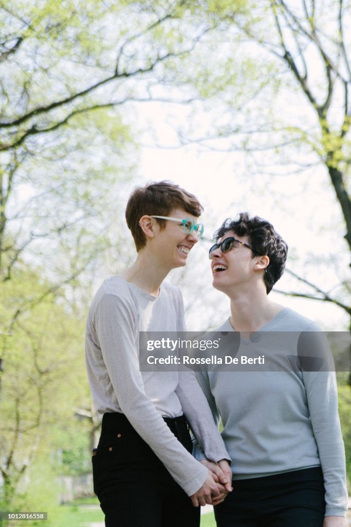 Lesbian couple walking hand in hand