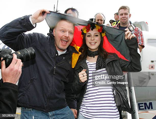 Lena Meyer-Landrut, winner of the Eurovision Song Contest 2010 and TV host Stefan Raab arrive at Hanover airport on May 30, 2010 in Hanover, Germany....