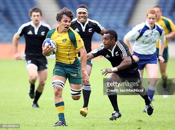Nick Phipps of Australia races towards the try line persued by Lote Raikabula during the match between Australia and New Zealand during the the IRB...