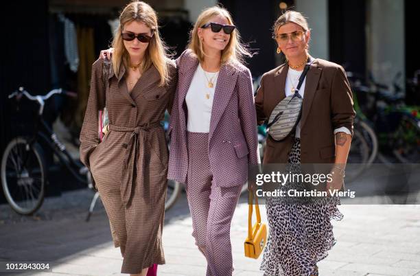 Annabel Rosendahl wearing see through sheer bag, brown belted trench coat and Tine Andrea wearing pink suit and Janka Polliani wearing Dior belt bag,...
