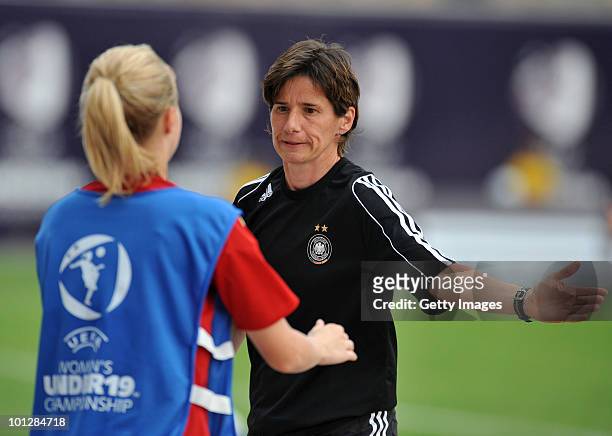 Maren Meinert coach of German national team celenbrates after wining the UEFA Women's Under-19 European Championship group A match between England...