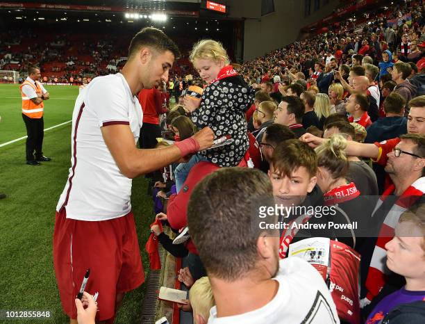 Marko Grujic of Liverpool signing autographs and taking selfies at the end of the Pre-Season friendly match between Liverpool and Torino at Anfield...