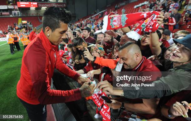 Roberto Firmino of Liverpool signing autographs and taking selfie at the end of the Pre-Season friendly match between Liverpool and Torino at Anfield...