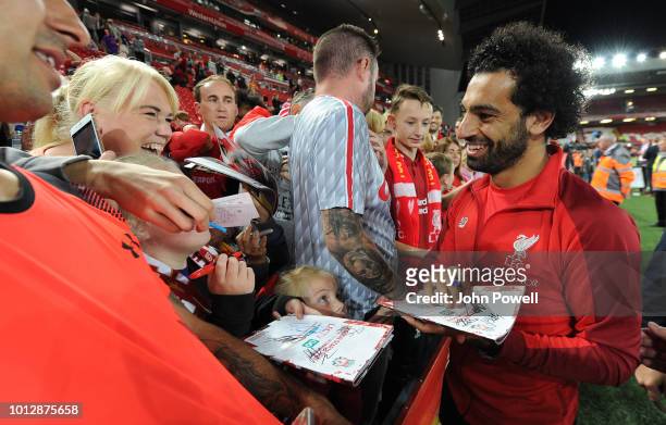 Mohamed Salah of Liverpool signing autographs and taking selfie at the end of the Pre-Season friendly match between Liverpool and Torino at Anfield...
