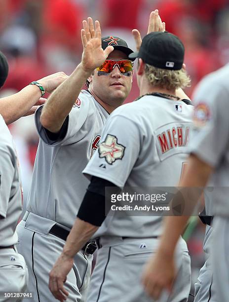 Lance Berkman of the Houston Astros is congratulated by Jason Michaels following their 2-0 win over the Cincinnati Reds at Great American Ball Park...