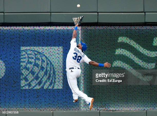 Ball hit by David Bote of the Chicago Cubs goes over the glove of Jorge Bonifacio of the Kansas City Royals for a two-run triple in the first inning...