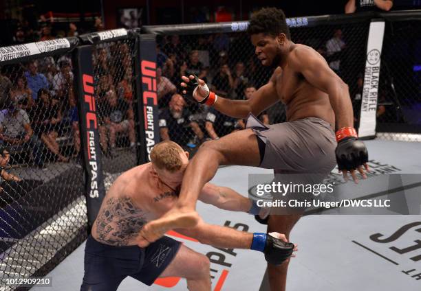 Kennedy Nzechukwu kicks Dennis Bryant in their light heavyweight fight during Dana White's Tuesday Night Contender Series at the TUF Gym on August 7,...