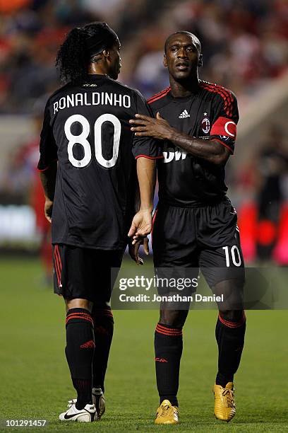 Clarence Seedorf and Ronaldinho of AC Milan greet each other as Ronaldinho is taken out of the match in the second half while taking on the Chicago...
