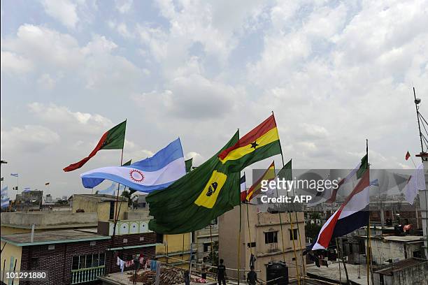 Fbl-WC2010-Bangladesh-Brazil-Argentina-economy,FEATURE by Shafiq Alam National flags of countries competing in the FIFA World Cup flutter above the...