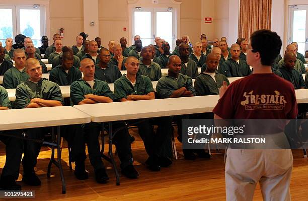Rebecca Dunne from Tri-State Bird Rescue lectures prisoners from the Elayn Hunt Correctional Center on how to cleanse oil from birds affected by the...