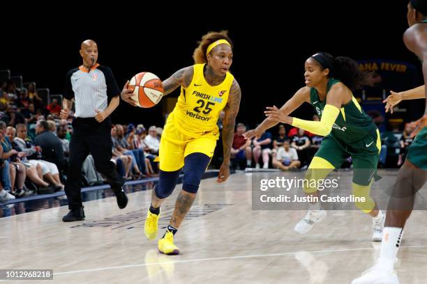 Cappie Pondexter of the Indiana Fever handles the ball during the game against the Seattle Storm on August 7, 2018 at Bankers Life Fieldhouse in...