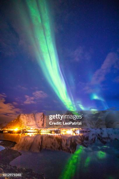 northern lights in the sky of the lofoten islands in norway - norge stock pictures, royalty-free photos & images