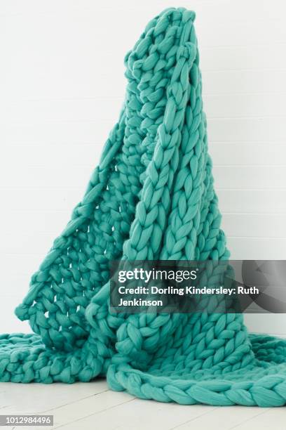 arm knitted turquoise green blanket - draped blanket stock pictures, royalty-free photos & images