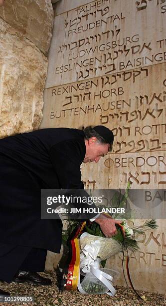 German President Horst Koehler lays a wreath at the Valley of the Communities in the Yad Vashem Holocaust memorial complex in Jerusalem 01 February...