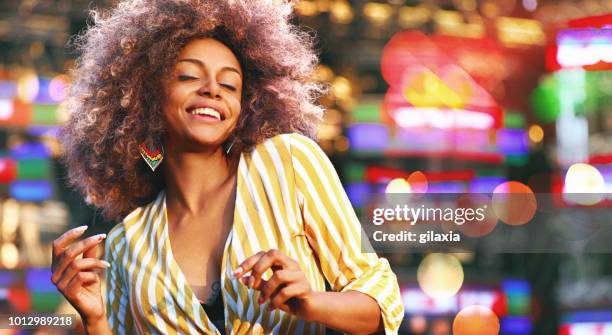 black woman dancing at a concert. - black women singing stock pictures, royalty-free photos & images