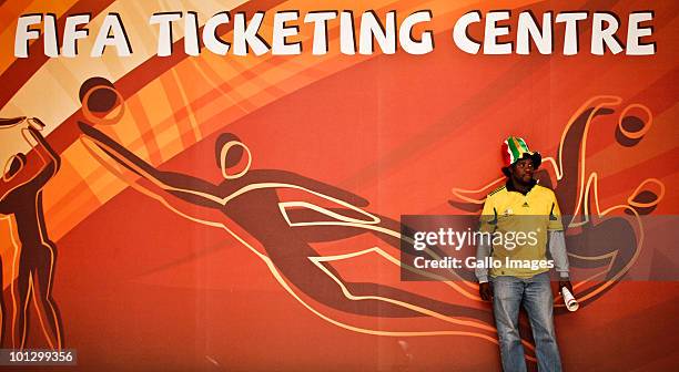 Fan football waits in line in a queue to buy Fifa World Cup 2010 tickets at the ticket centre on May 28, 2010 in Sandton, South Africa. The ticket...