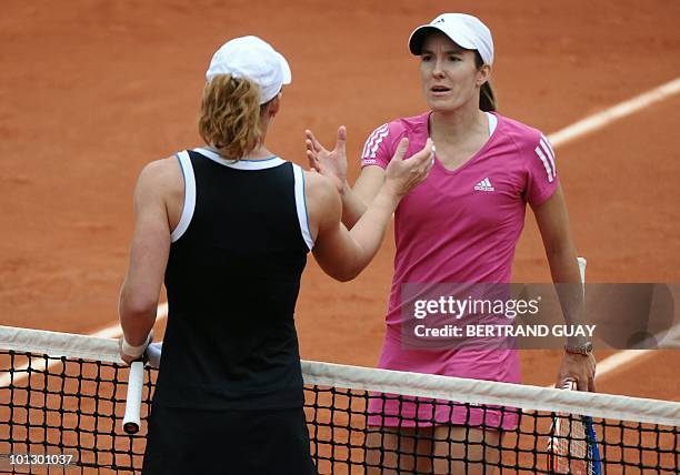 Australia's Samantha Stosur shakes hands with Belgium's Justine Henin during their women's fourth round match in the French Open tennis championship...