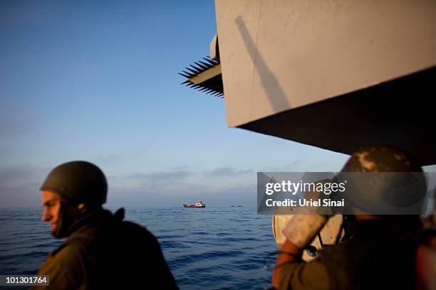 Israeli Navy soldiers stand guard on a missile ship as the Israeli Navy intercepts peace boats bound for Gaza on May 31, 2010 in the Mediterranean...