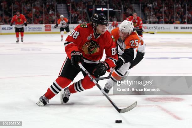 Patrick Kane of the Chicago Blackhawks handles the puck against Matt Carle of the Philadelphia Flyers in Game One of the 2010 NHL Stanley Cup Final...