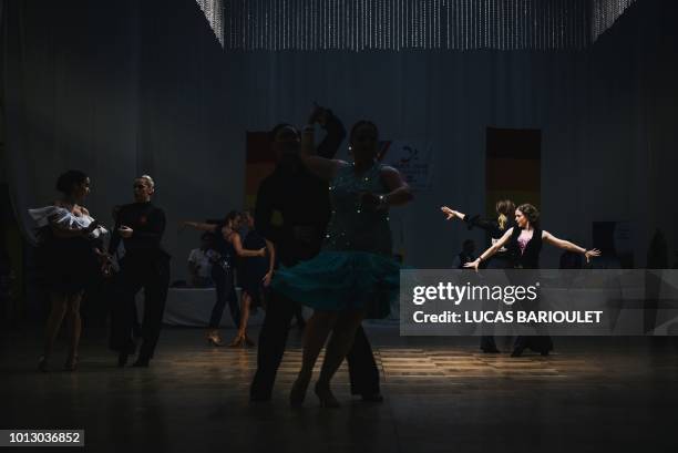 Participants compete in the dancing contest during the 10th edition of the international Gay Games at the Gymnase Japy in Paris on August 7, 2018. -...