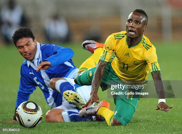 Teko Modise of South Africa is tackled by Carlos Galledo of Guatamala during the International Friendly match between South Africa and Guatemala at...