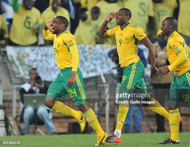 Surprise Moriri of South Africa celebrates with Katlego Mphela and Lucas Thwalaafter scoring the third goal during the International Friendly match...