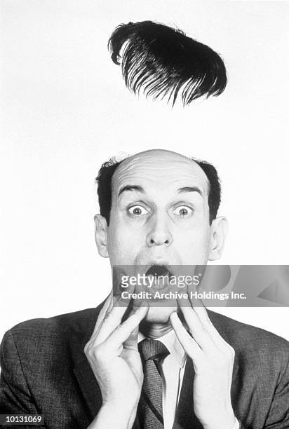 mans hairpiece flies off in shock, 1950s or 1960s, flipping his lid - tousled hair man stock pictures, royalty-free photos & images