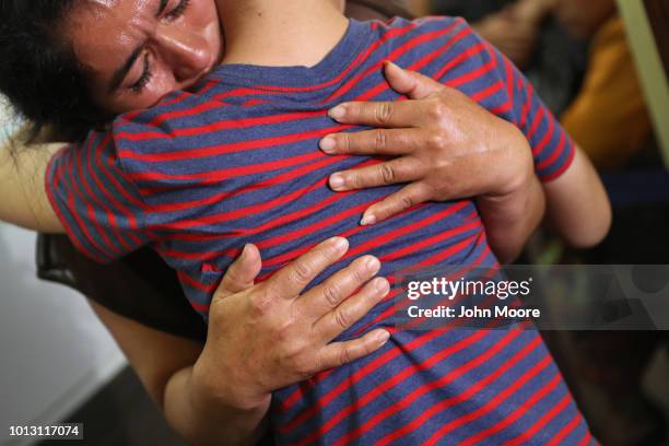 Isidra Larena Calderon hugs her son Jonathan Leonardo on August 7, 2018 in Guatemala City, Guatemala. A group of nine children were flown from New...